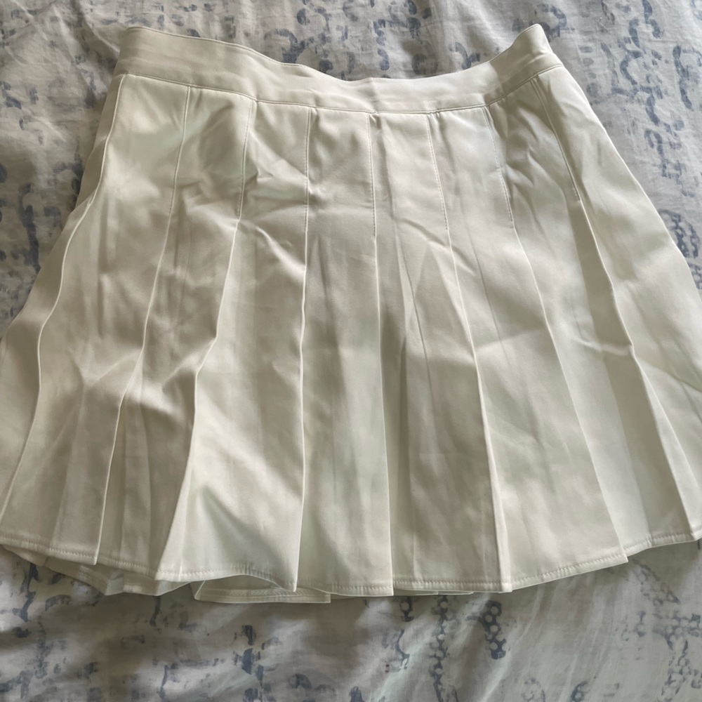 White pleated skirt